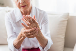 Elderly woman with arthritis pain