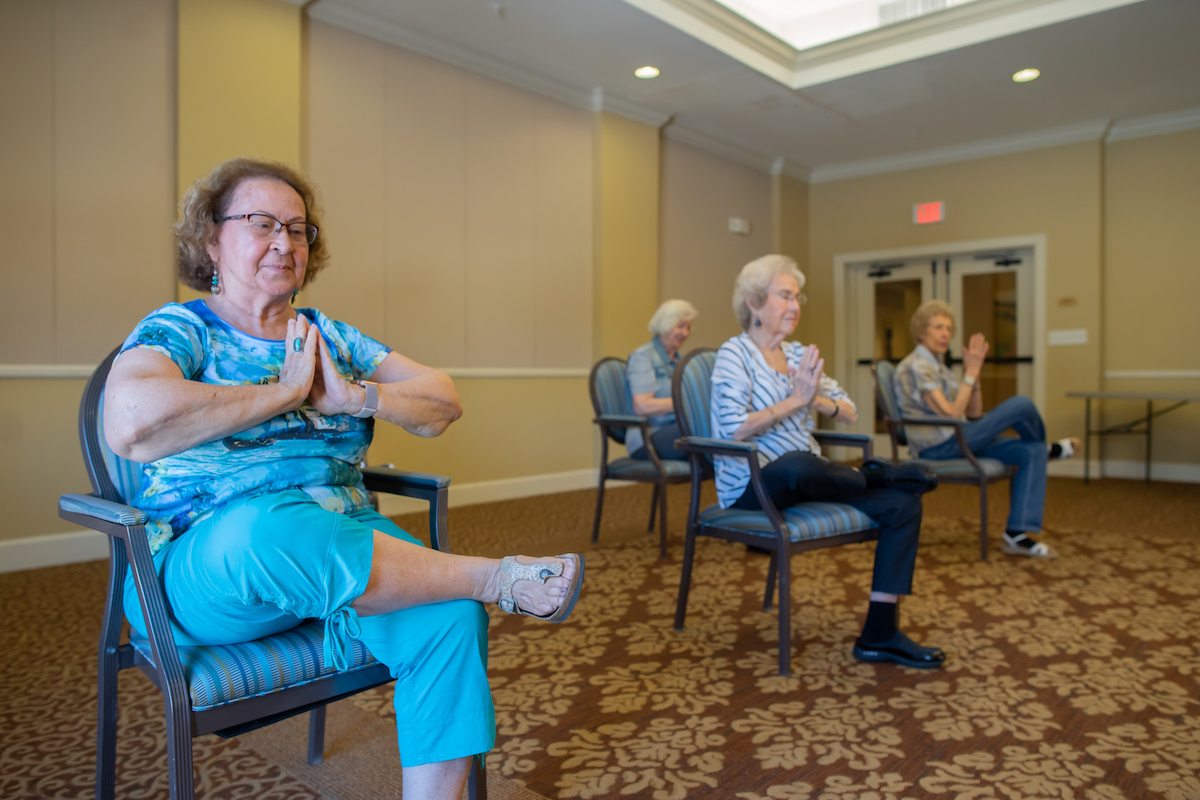Seniors Doing Chair Yoga_Franklin Park® Senior Living