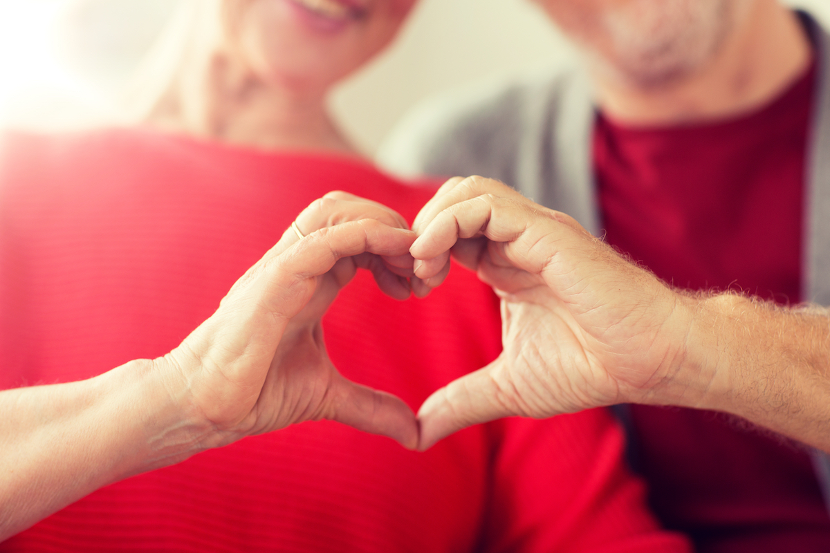 Senior Couple Forming Heart Shape with Hands_Franklin Park® Senior Living