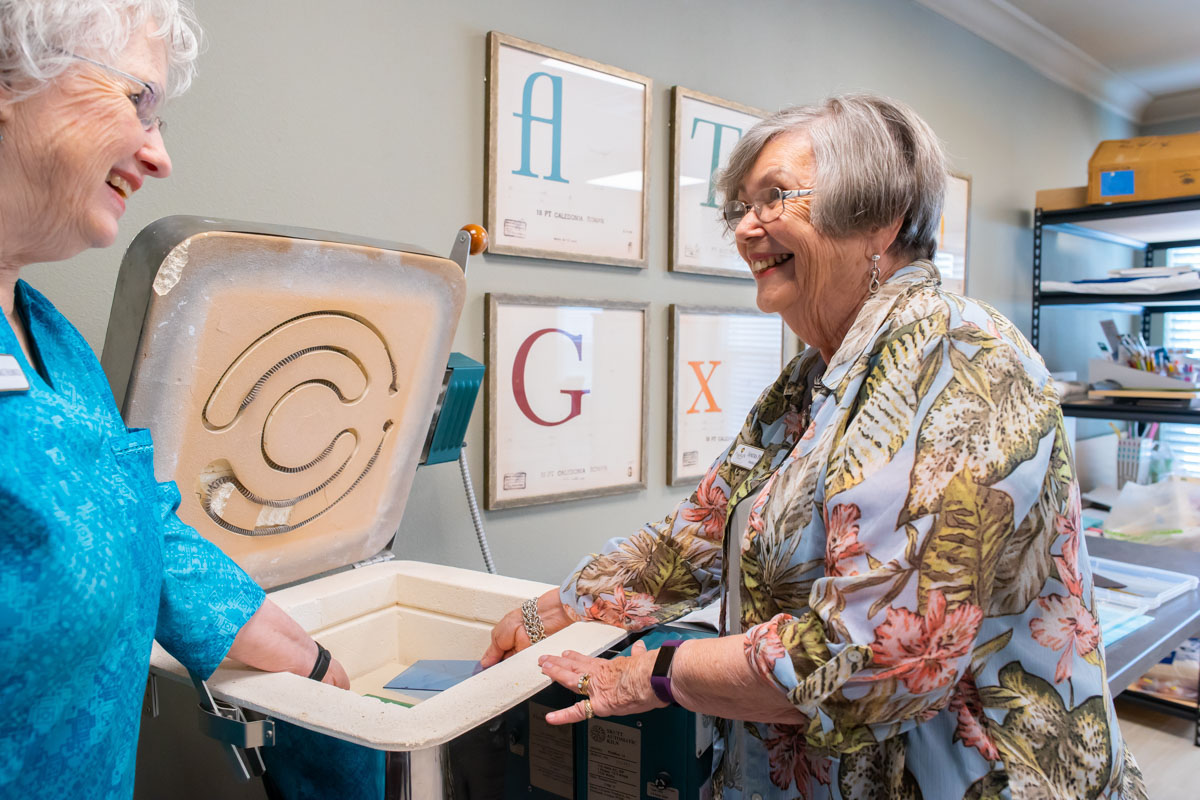 Smiling Senior Women Load Kiln_Franklin Park® Senior Living