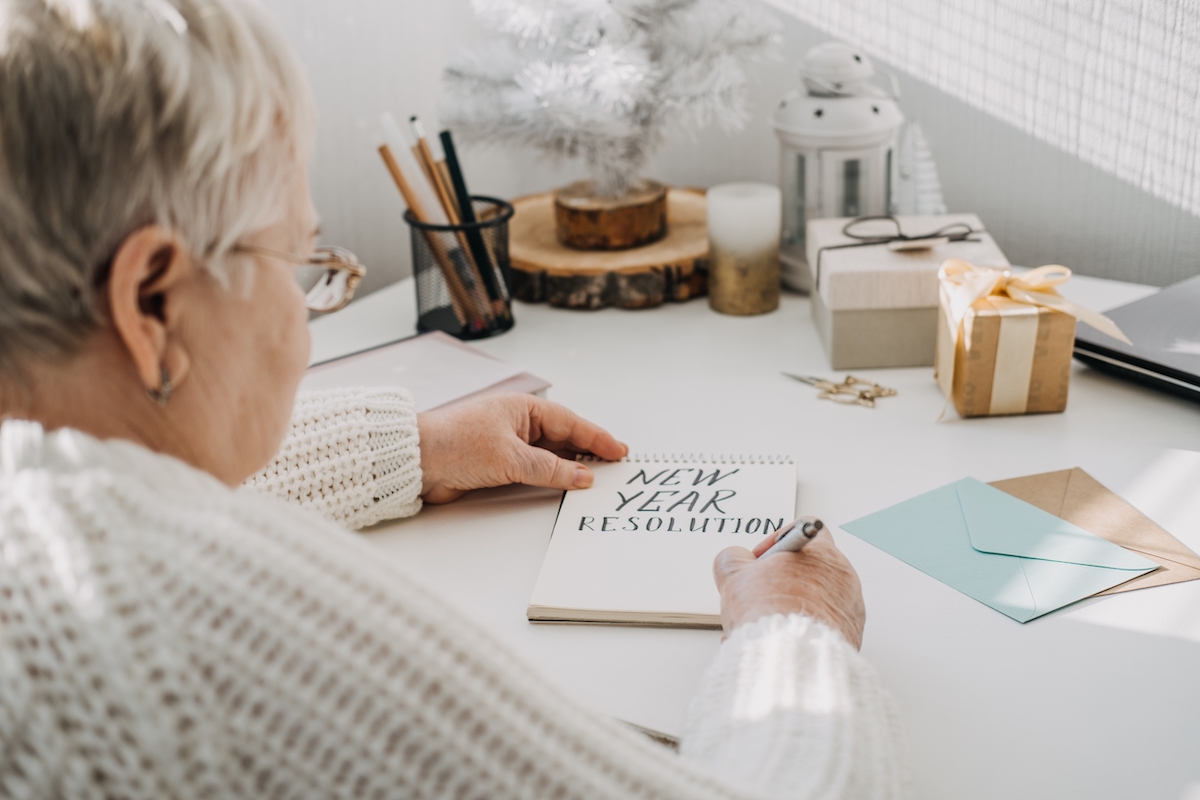 Senior Woman Writing New Year's Resolutions_Franklin Park® Senior Living