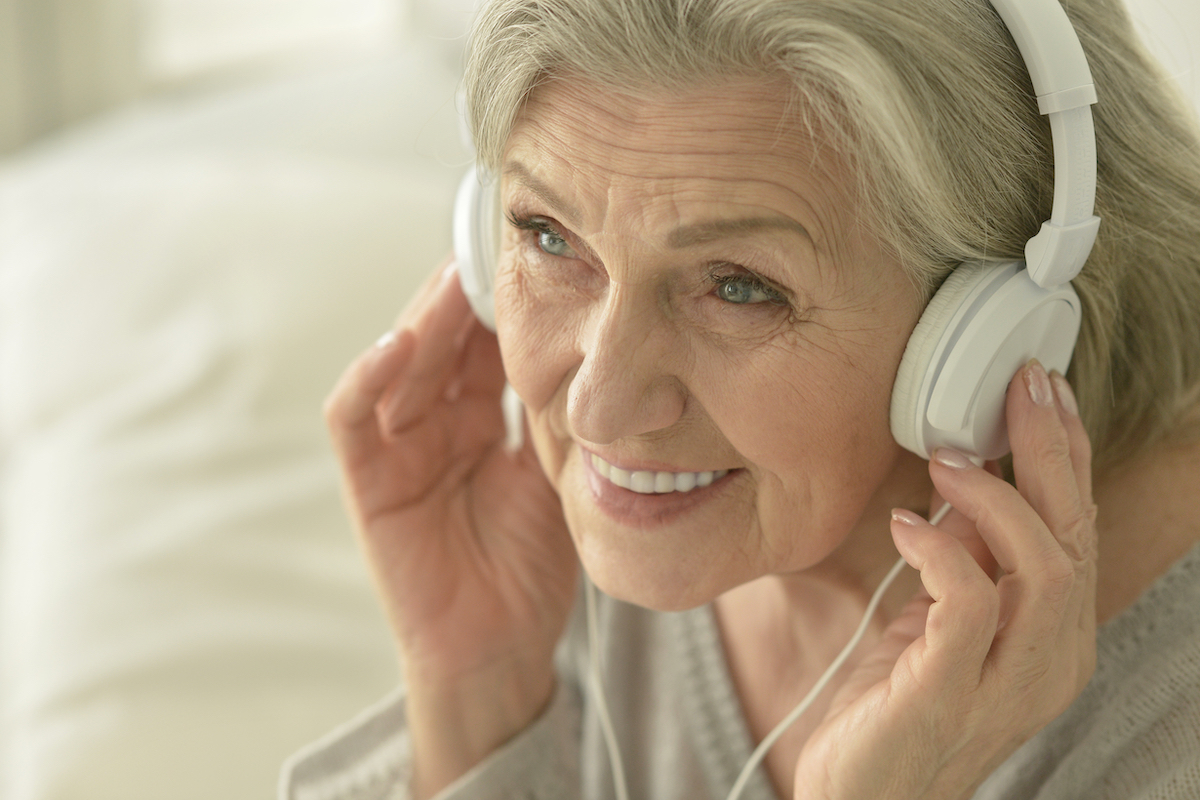 Close Up of Senior Woman Wearing Headphones_Franklin Park® Senior Living