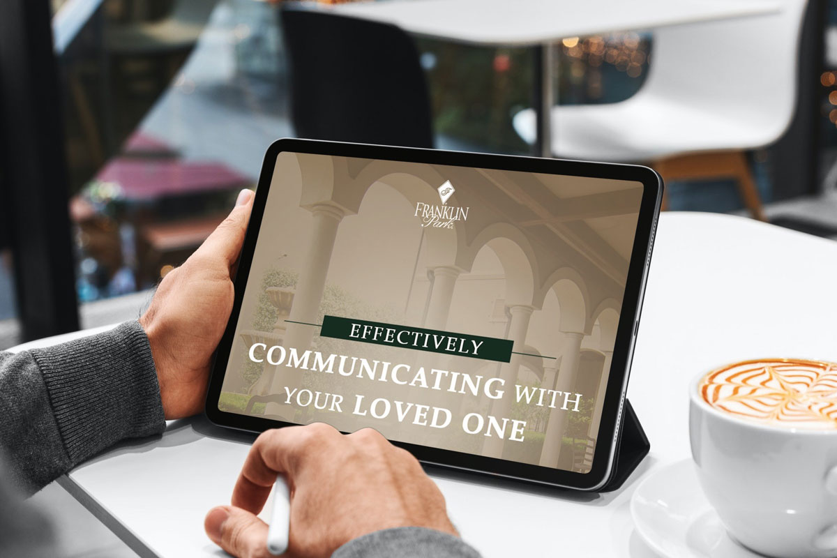 Tablet displaying communication guide beside latte