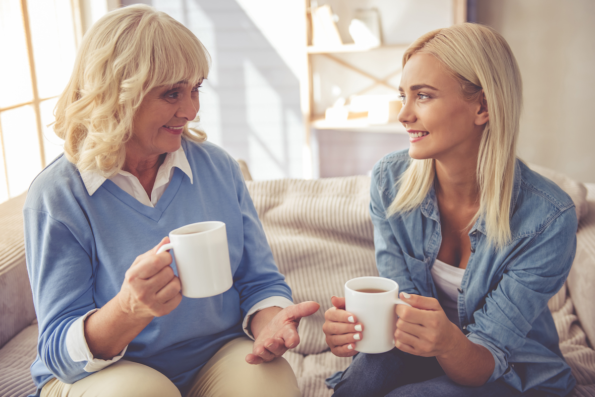Beautiful,Old,Woman,And,Young,Girl,Are,Drinking,Tea,,Talking