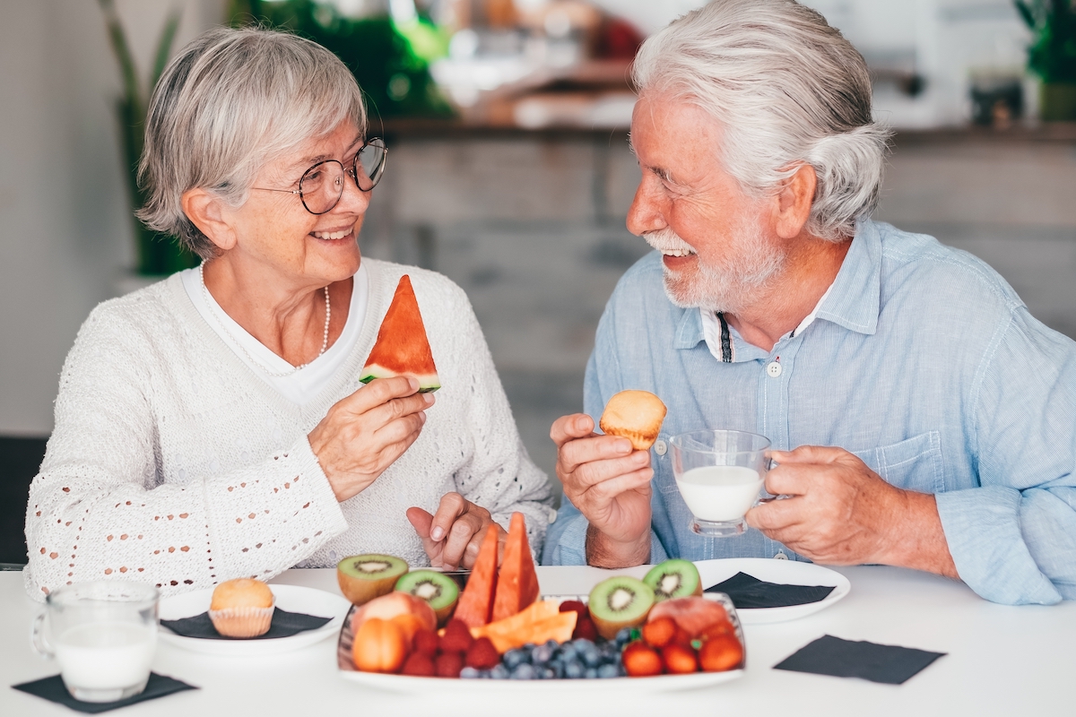 Cheerful,Beautiful,Senior,Couple,At,Home,Having,Breakfast,Together,With
