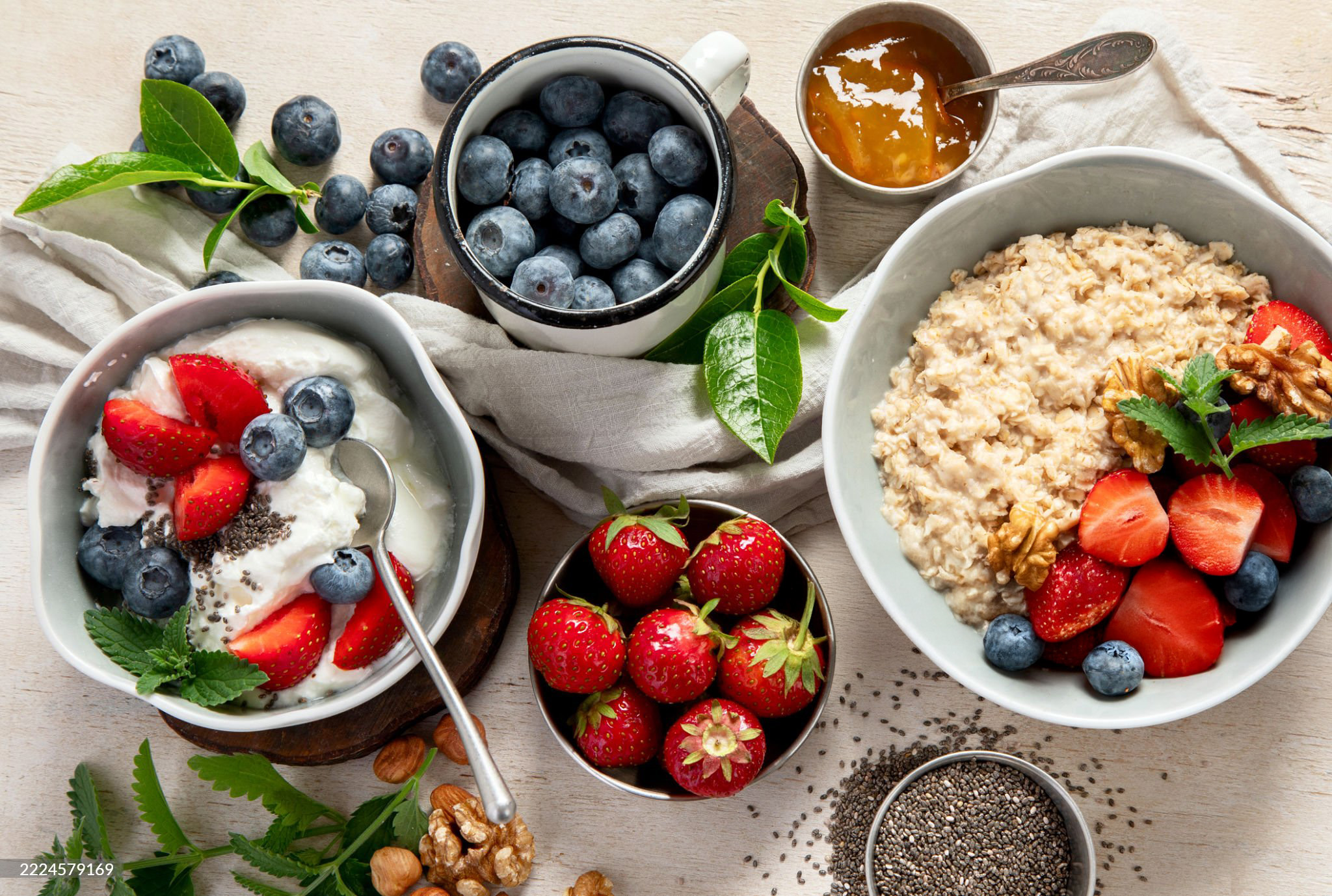 Healthy breakfast with oatmeal, yogurt, and fresh berries