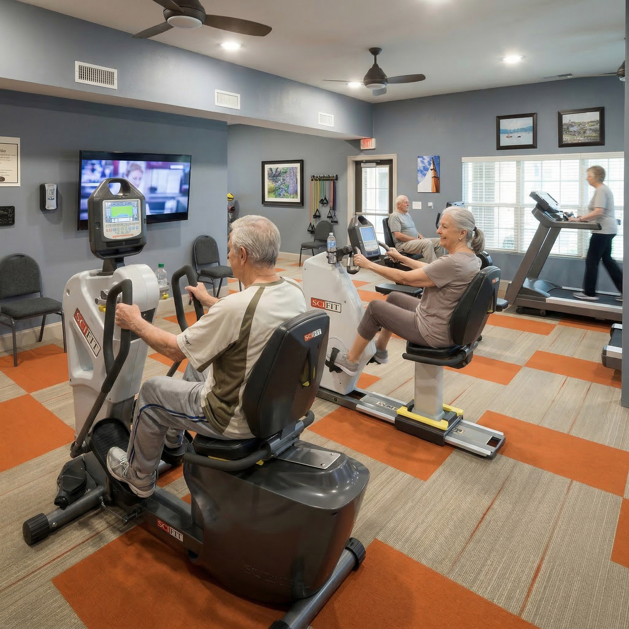 Seniors exercising on bikes in fitness room