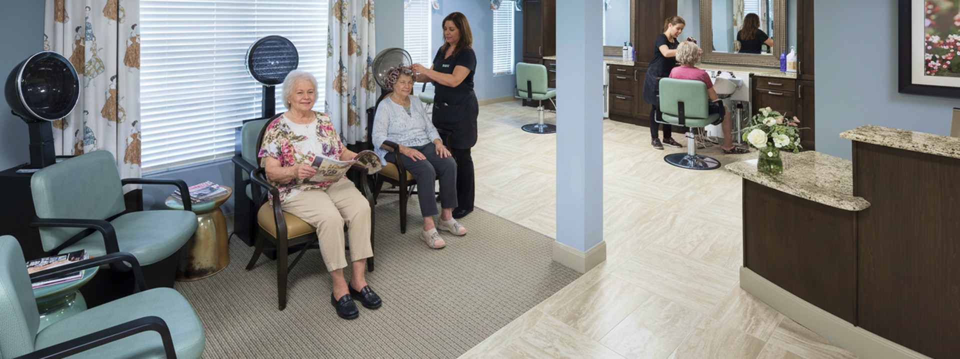 Elderly women at salon with hairstylist working