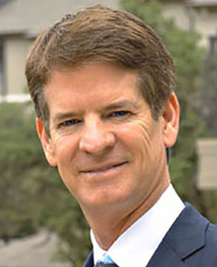 Man in suit smiling outdoors portrait