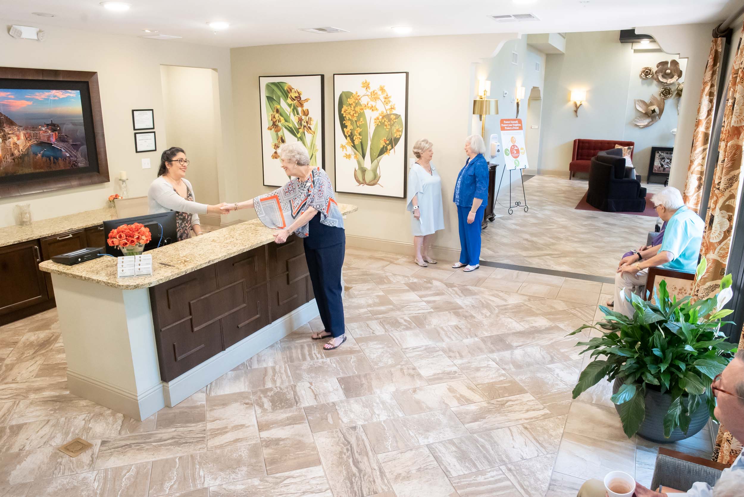 Senior living community reception area with residents