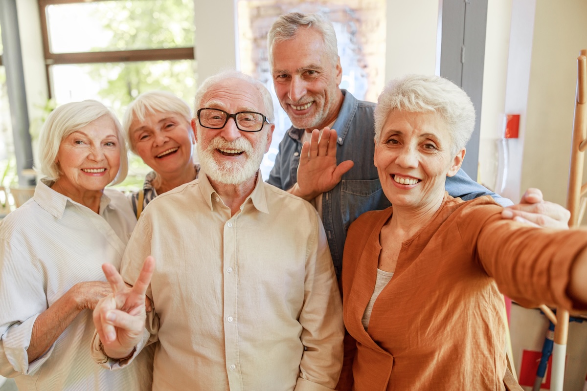 Cheerful,Old,People,Looking,At,Camera,And,Smiling,Stock,Photo