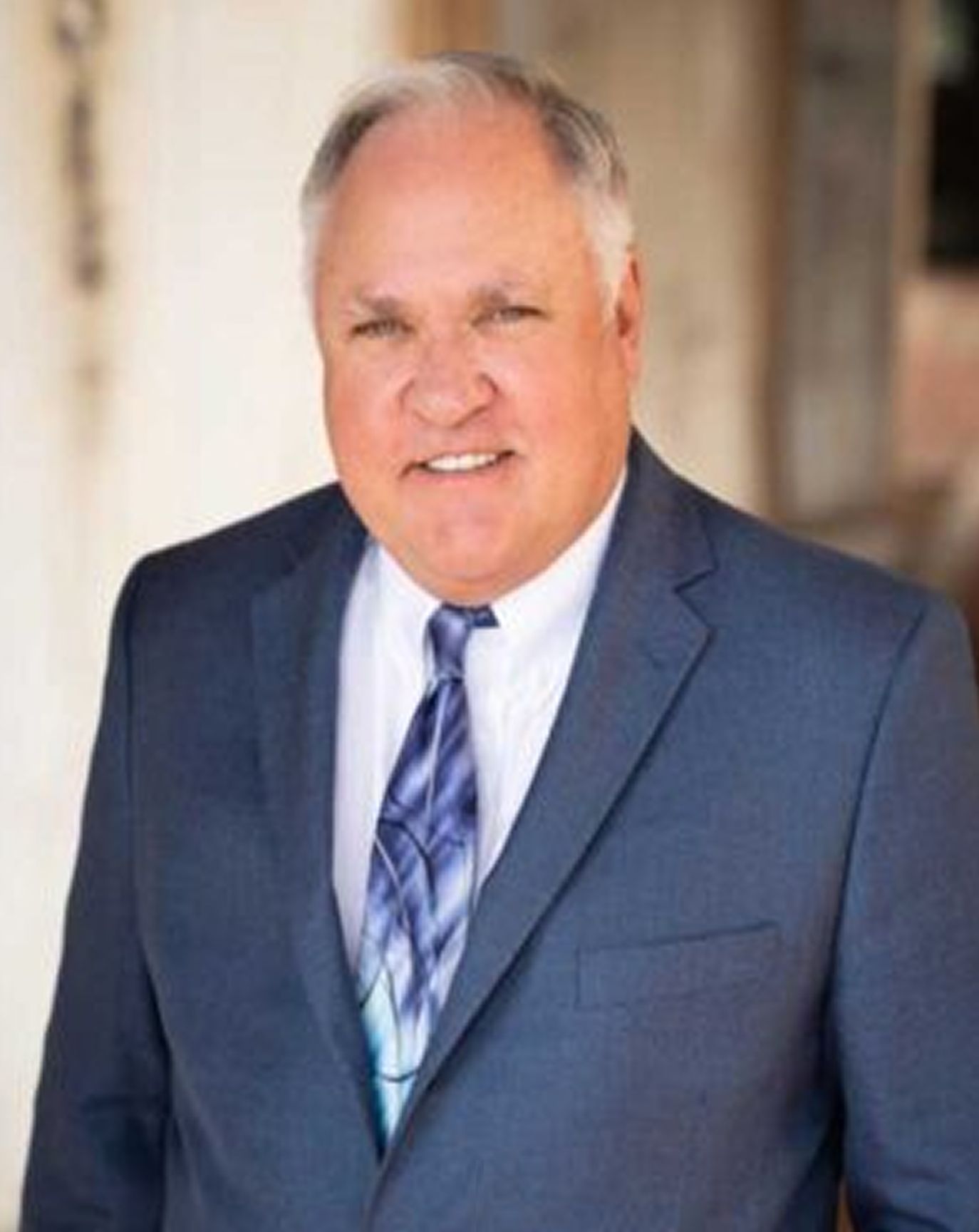 Man in blue suit and tie